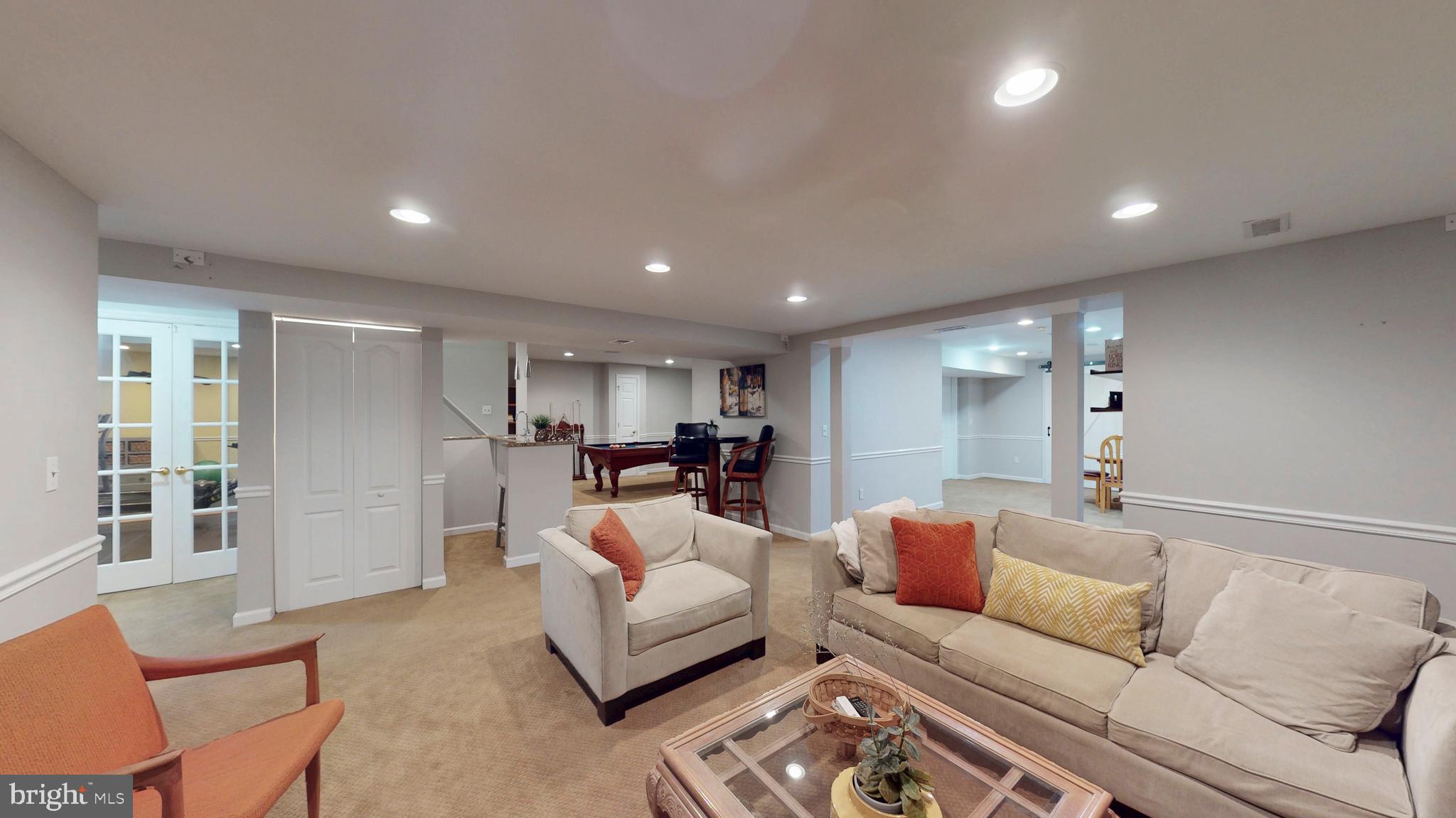 9728 Middleton Ridge Road Vienna, VA 22182 - Photo 63 of 81 a living room with furniture and a large window