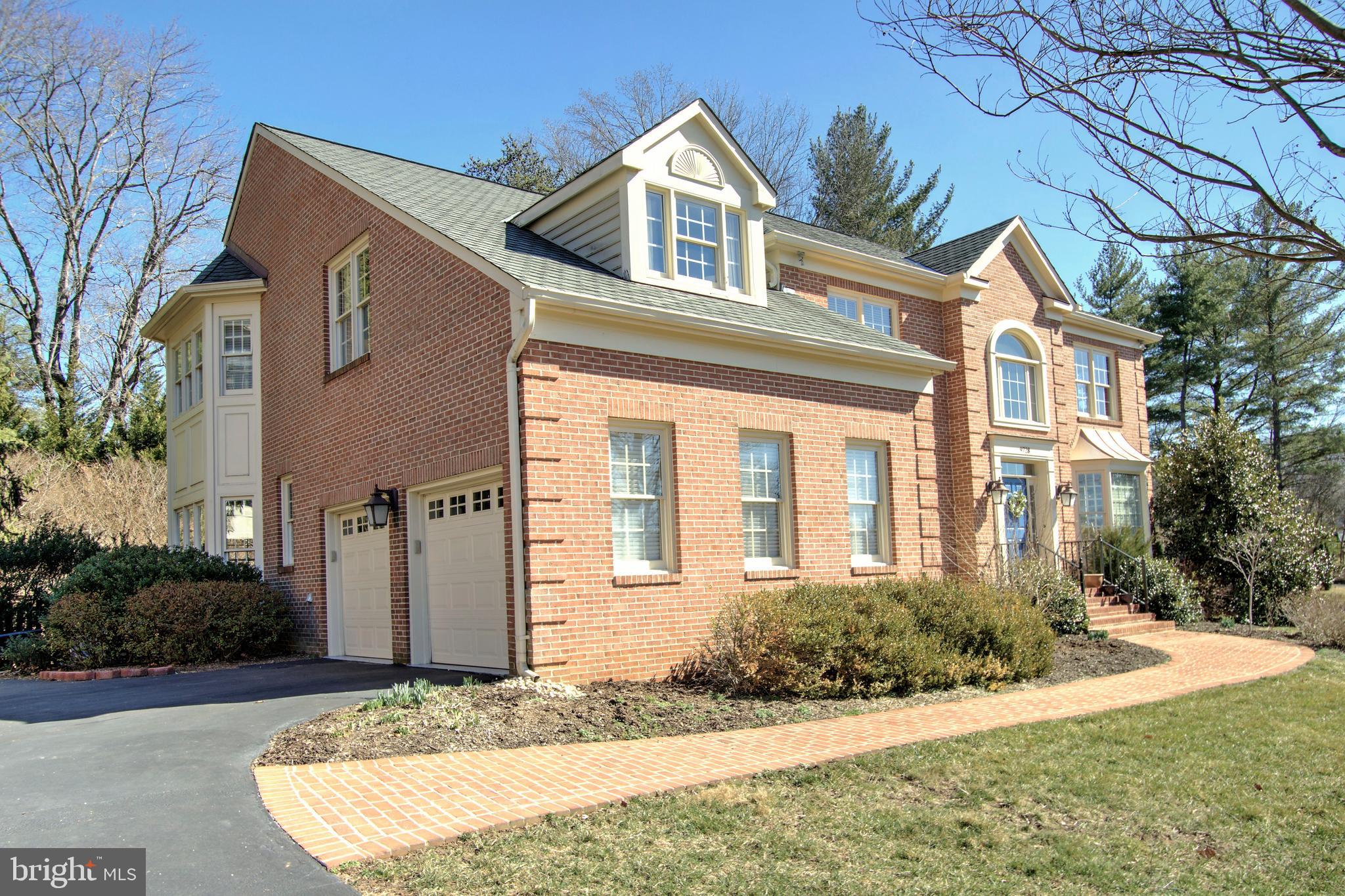 9728 Middleton Ridge Road Vienna, VA 22182 - Photo 70 of 81 a front view of a house with a yard