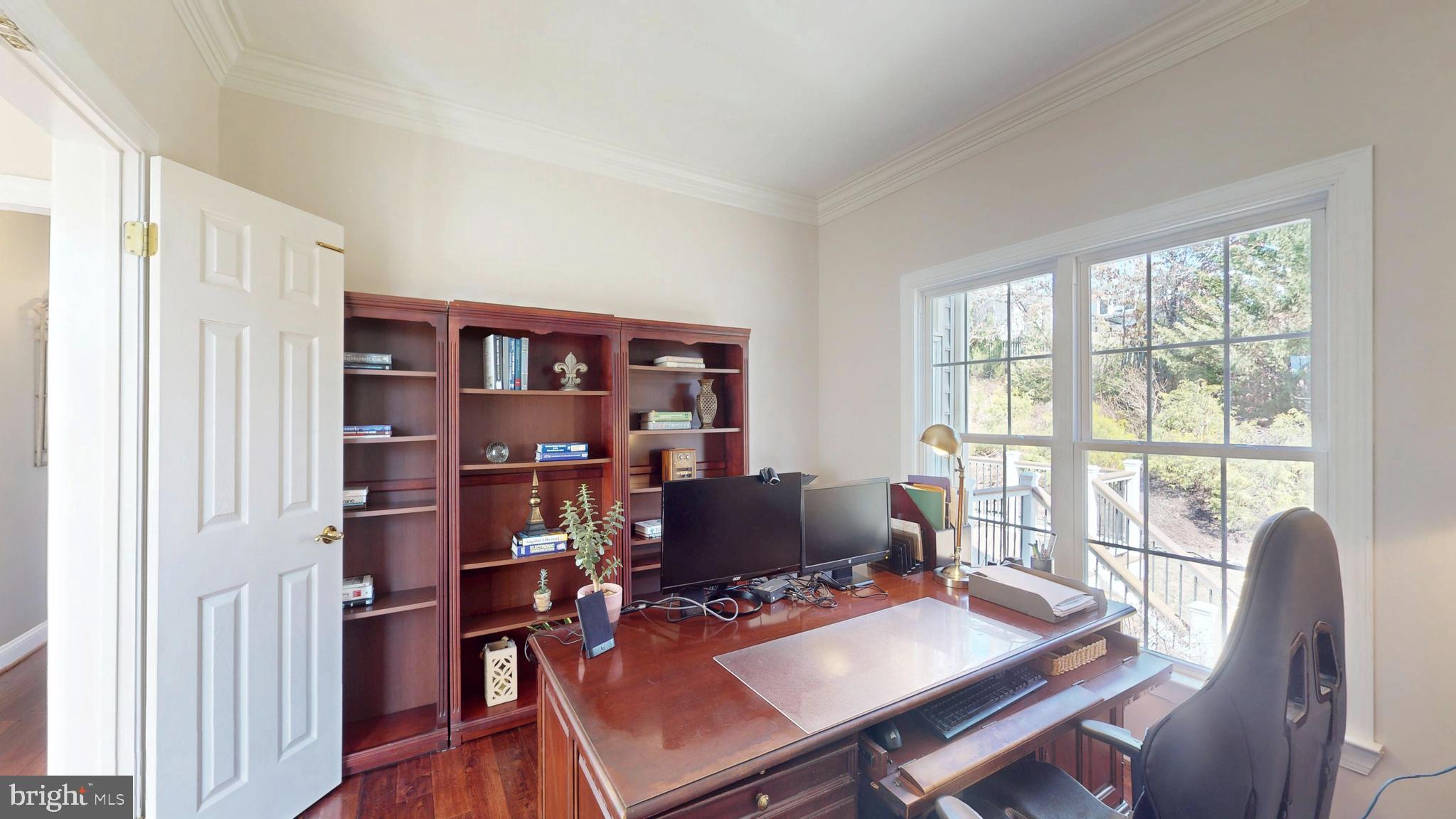 9728 Middleton Ridge Road Vienna, VA 22182 - Photo 9 of 81 a workspace with furniture hardwood and a window