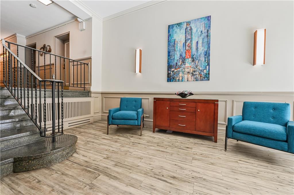 9430 Ridge Boulevard, Unit 1F Brooklyn, NY 11209 - Photo 6 of 6 a living room with furniture and a wooden floor