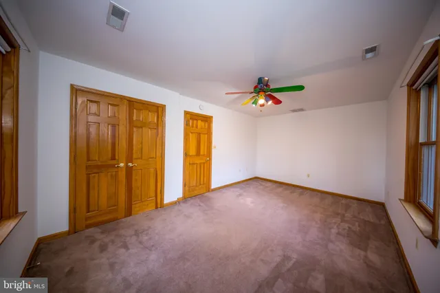 a view of an empty room and window