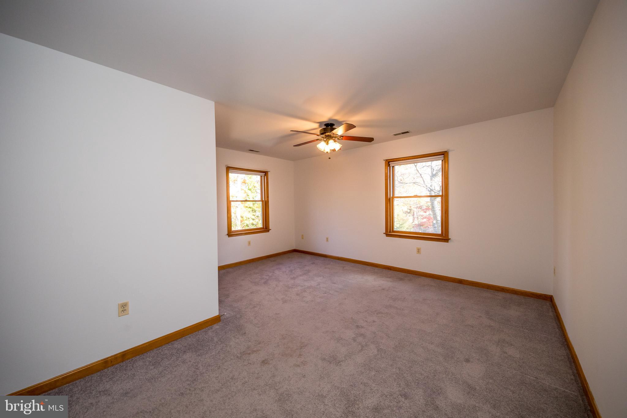 20 Glade Avenue Baltimore, MD 21236 - Photo 21 of 42 an empty room with windows and closet