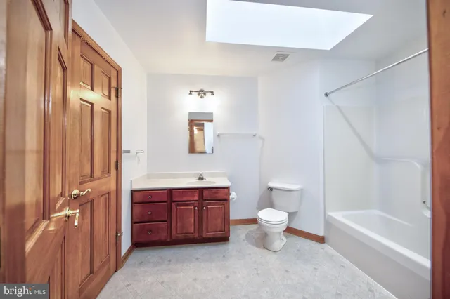 a bathroom with a toilet sink and bathtub