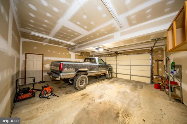 a view of a garage with parked cars