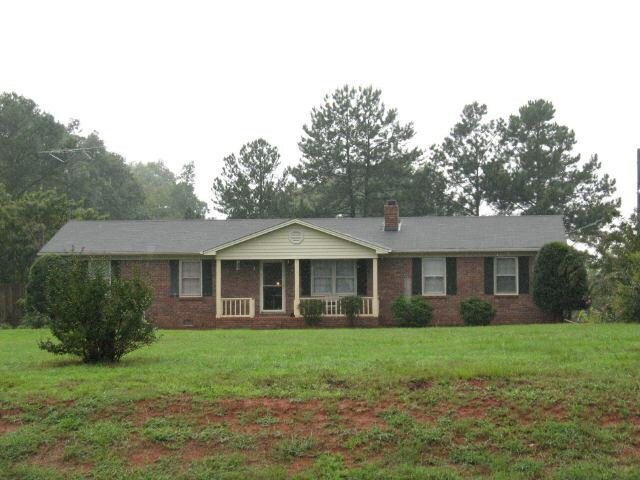 4628 Wildcat Bridge Road Royston, GA 30662 - Photo 1 of 1 a front view of a house with a yard