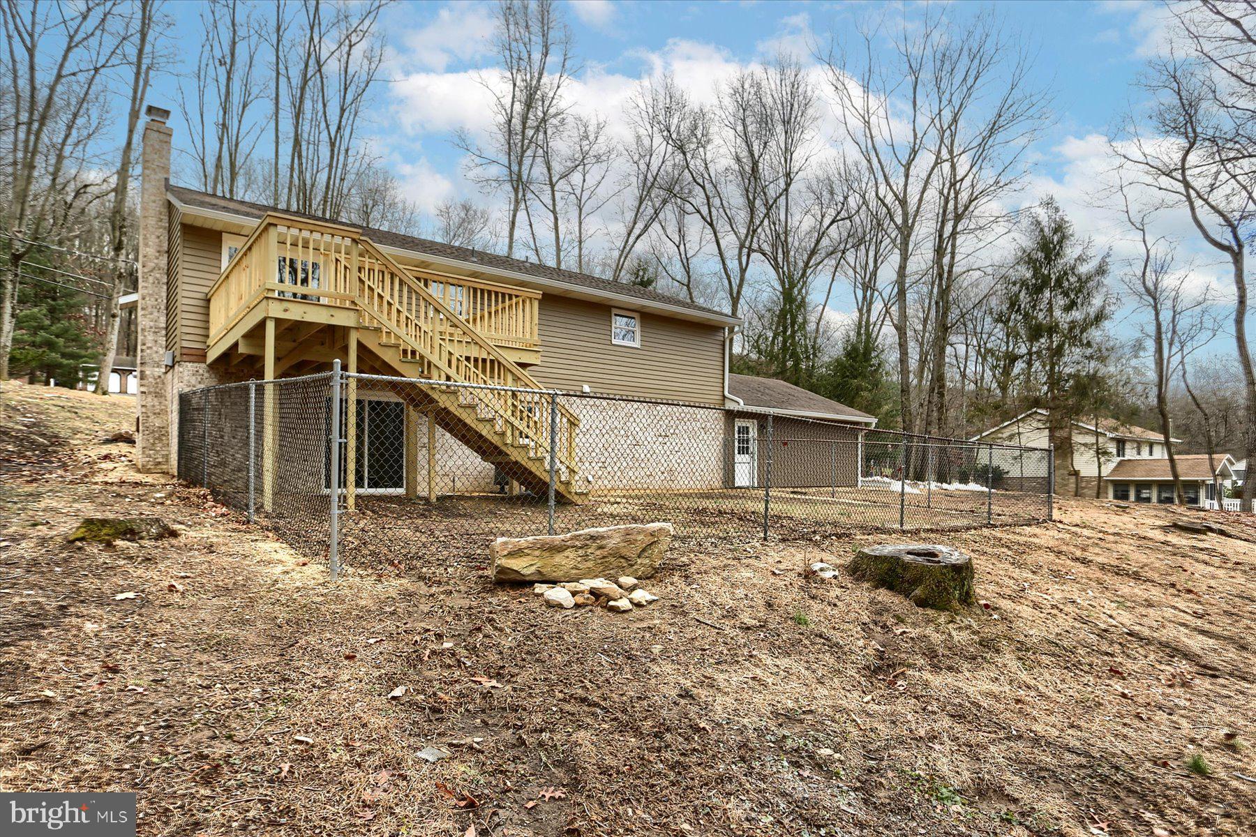 1348 Kuhn Road Boiling Springs, PA 17007 - Photo 40 of 45 Firepit in backyard with concrete pad..