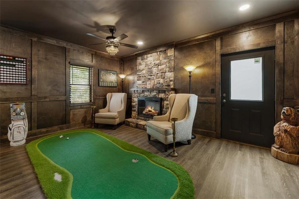 3910 Two Rivers Drive Cumming, GA 30041 - Photo 74 of 110 a living room with furniture and a fireplace