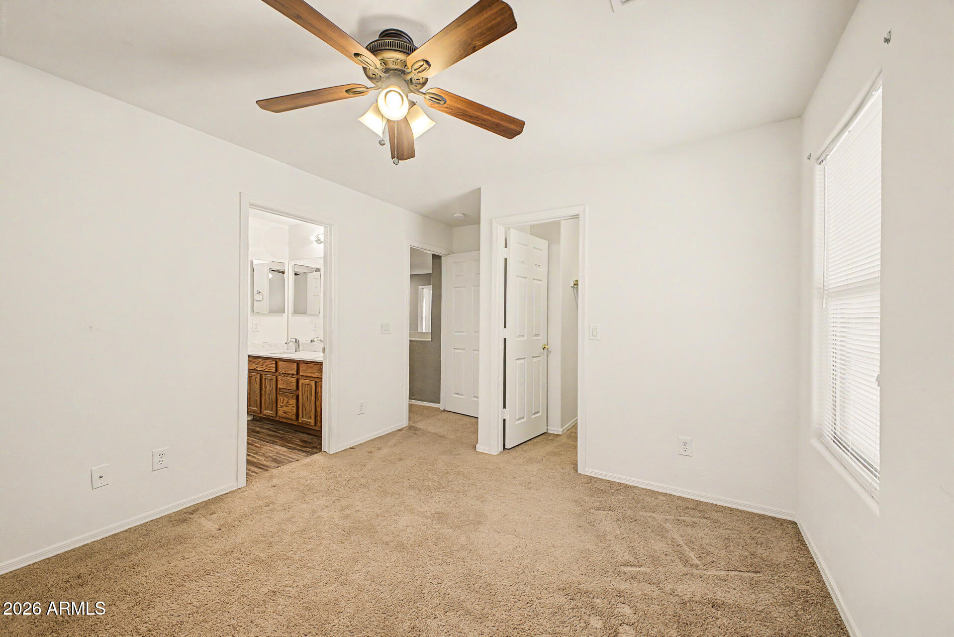 6622 West Harwell Road Laveen, AZ 85339 - Photo 23 of 32 an empty room with closet and fan