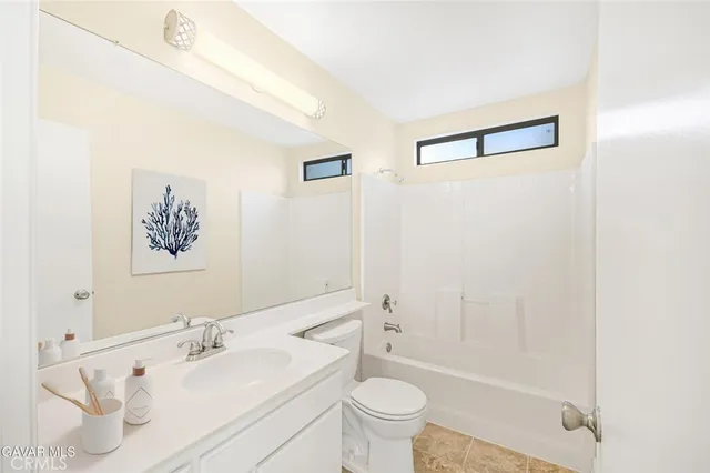a view of a patio with couches and potted plants