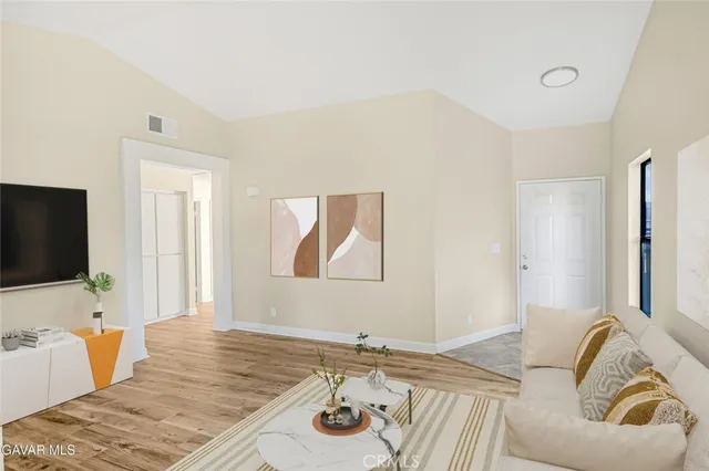 a bedroom with a bed and flat screen tv