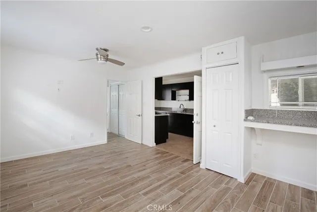 a view of a kitchen cabinets and wooden floor