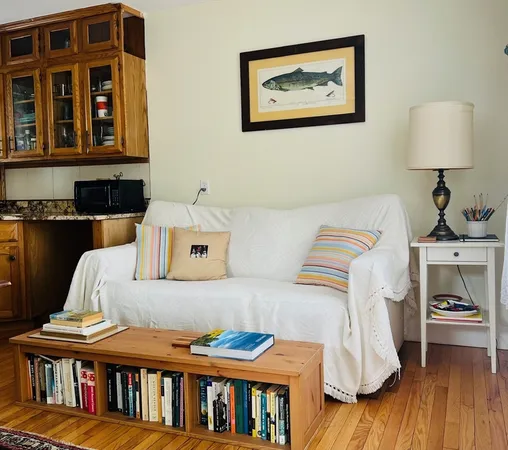 a bedroom with furniture and a wooden floor