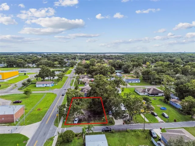 an aerial view of a house with a garden