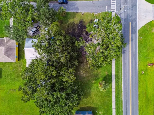 a view of a garden with a building in the background