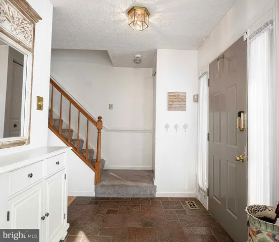 a view of an entryway with staircase