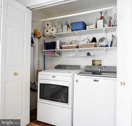 a view of a kitchen with washer and dryer