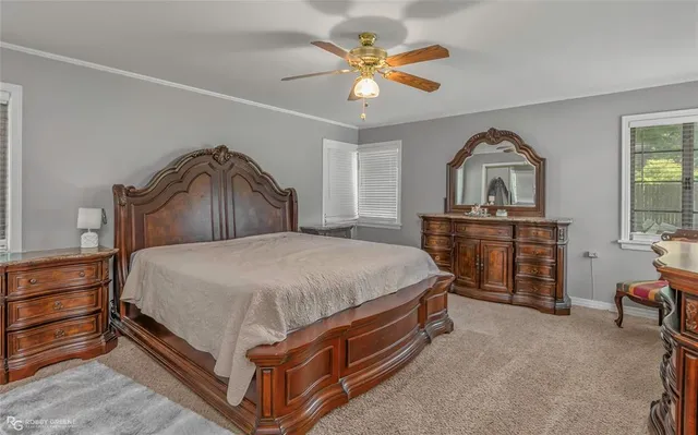 a bed room with a bed and a chandelier