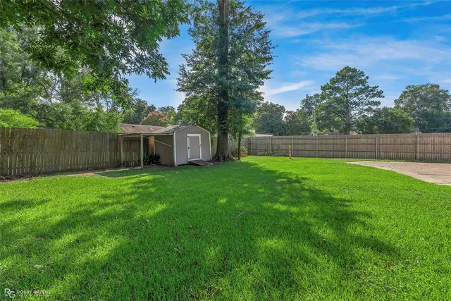 a view of a backyard with a garden