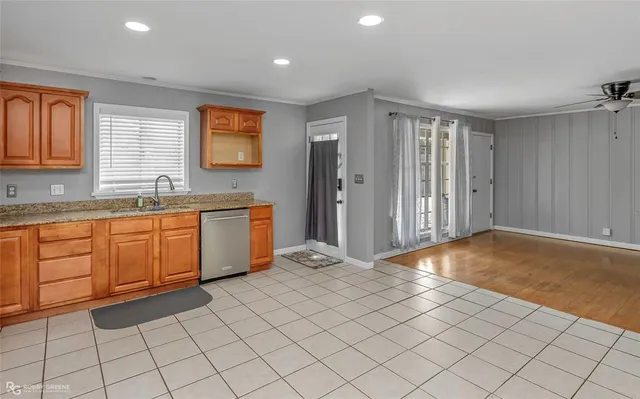 a view of a kitchen with sink cabinets and window