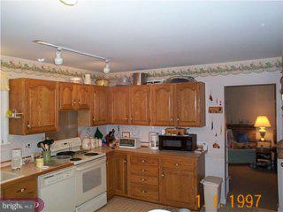 14 Worral Court Newark, DE 19711 - Photo 4 of 4 a kitchen with a sink cabinets and appliances
