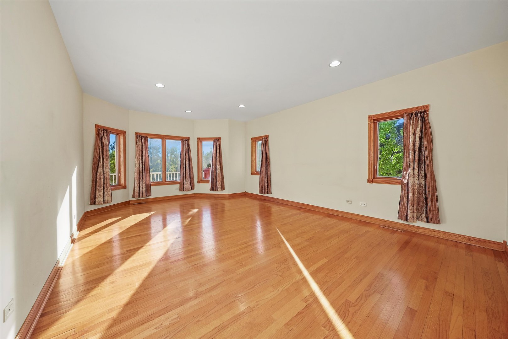 13220 Fox Lane Lemont, IL 60439 - Photo 11 of 43 a view of an empty room with a window and wooden floor