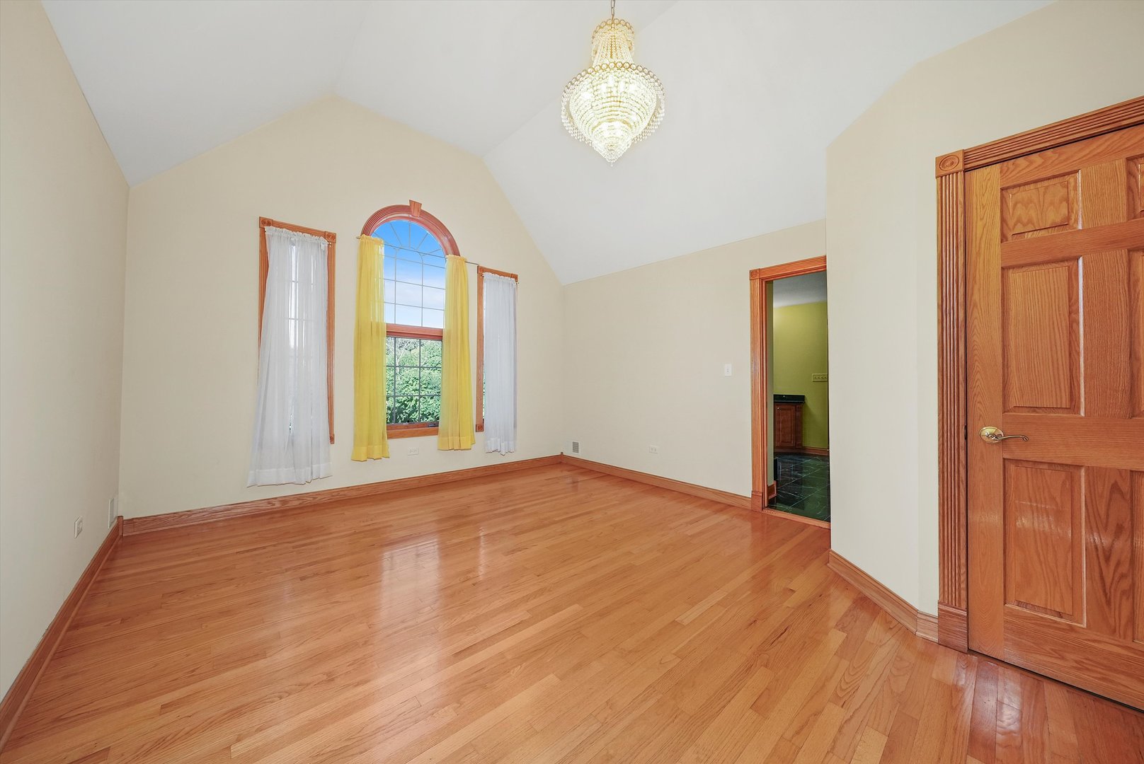 13220 Fox Lane Lemont, IL 60439 - Photo 14 of 43 a view of an empty room with a window and wooden floor