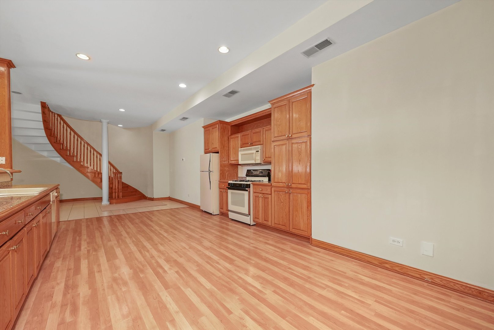 13220 Fox Lane Lemont, IL 60439 - Photo 24 of 43 a view of a kitchen with wooden floor and electronic appliances