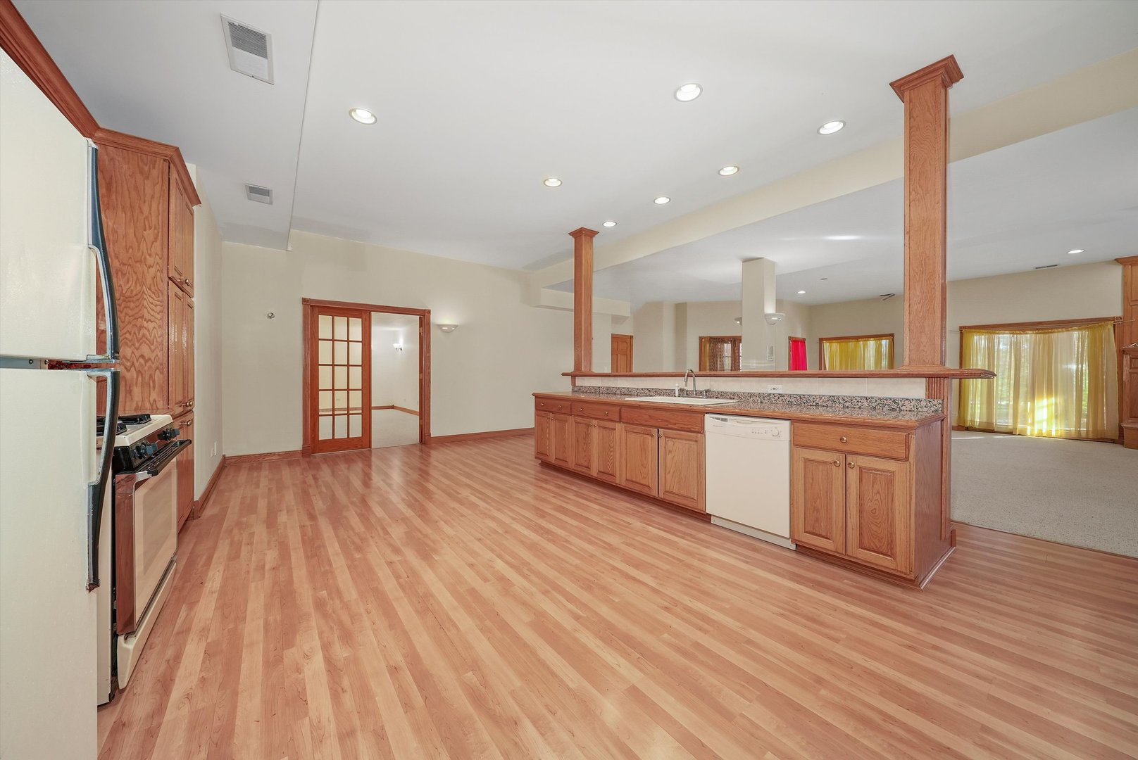 13220 Fox Lane Lemont, IL 60439 - Photo 25 of 43 a large kitchen with stainless steel appliances wooden floors and large window