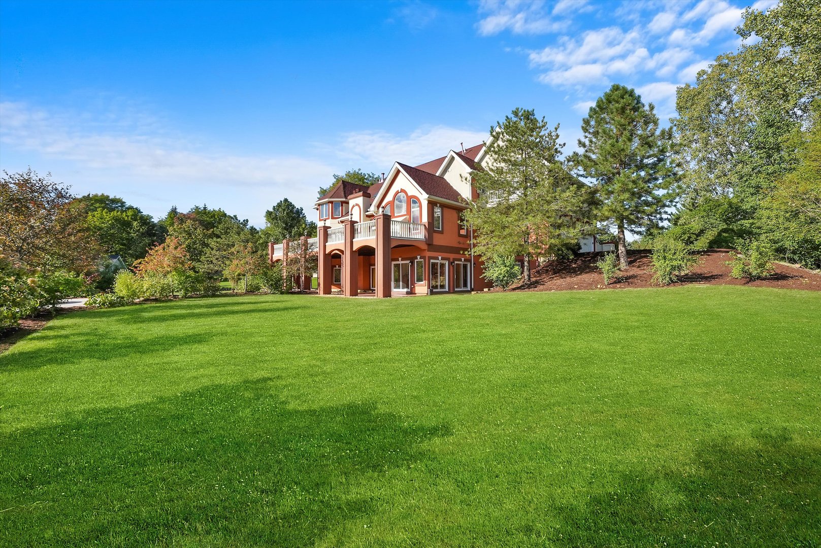 13220 Fox Lane Lemont, IL 60439 - Photo 35 of 43 a view of a building with a big yard and large trees