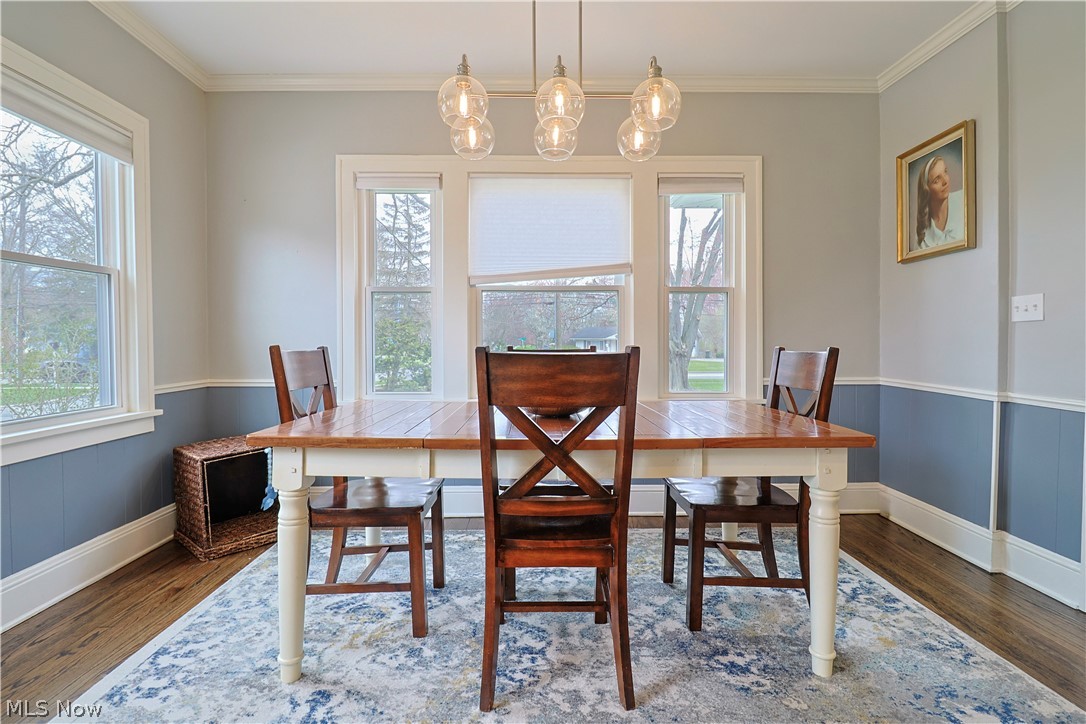 4376 Dover Center Road North Olmsted, OH 44070 - Photo 9 of 34 Dining space featuring crown molding and dark hardwood / wood-style flooring