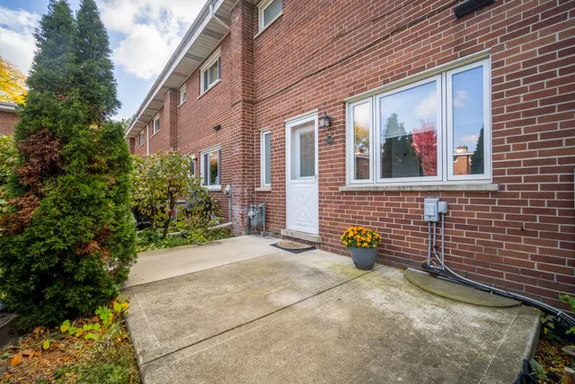 a view of a brick building with an outdoor space