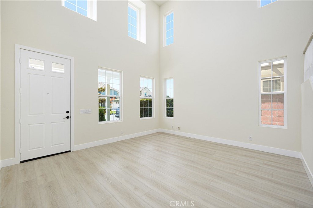 15 Plum Street Ladera Ranch, CA 92694 - Photo 14 of 113 an empty room with wooden floor and windows