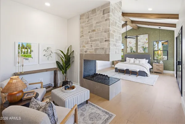 a living room with furniture a rug and a table
