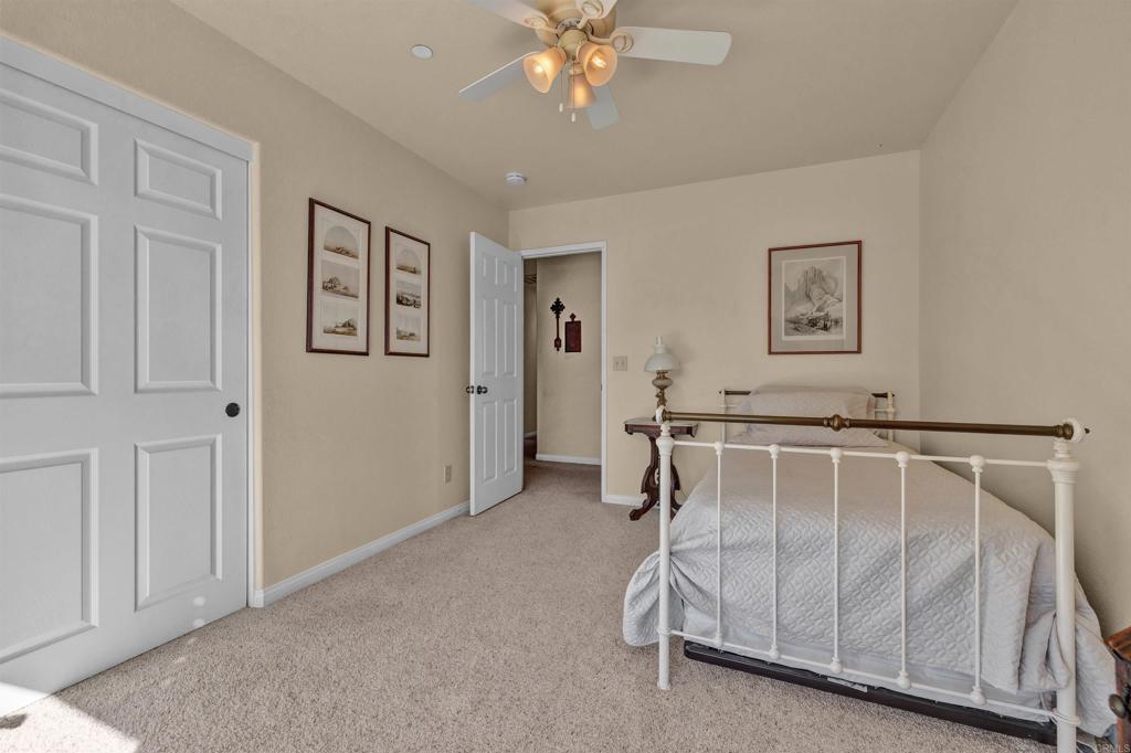 3486 Swinging V Road Borrego Springs, CA 92004 - Photo 13 of 41 a white bed sitting in a room next to a window