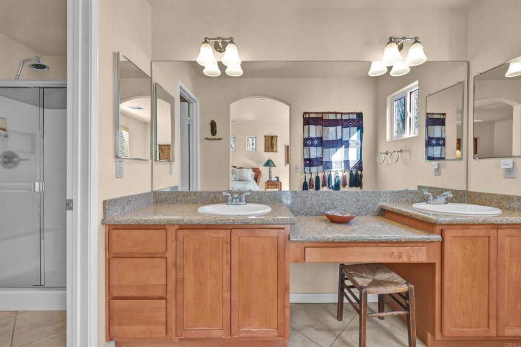 3486 Swinging V Road Borrego Springs, CA 92004 - Photo 16 of 41 a view of a kitchen counter space dining table and stainless steel appliances