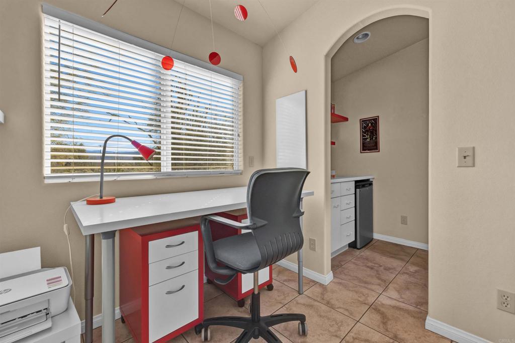 3486 Swinging V Road Borrego Springs, CA 92004 - Photo 26 of 41 a view of a workspace with furniture and a window