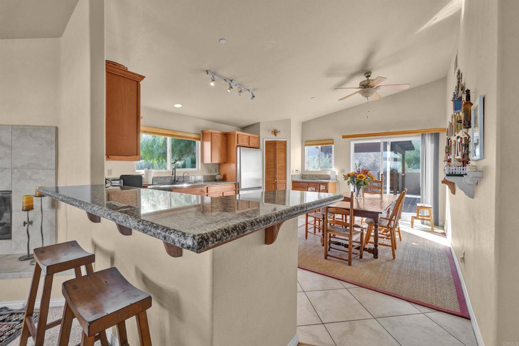 3486 Swinging V Road Borrego Springs, CA 92004 - Photo 7 of 41 a dining hall with stainless steel appliances granite countertop a dining table and chairs