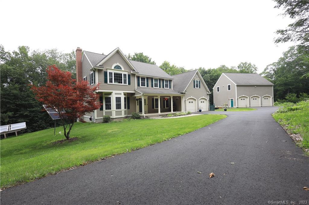 44 Ratlum Mountain Road Barkhamsted, CT 06063 - Photo 1 of 1 a front view of a house with garden