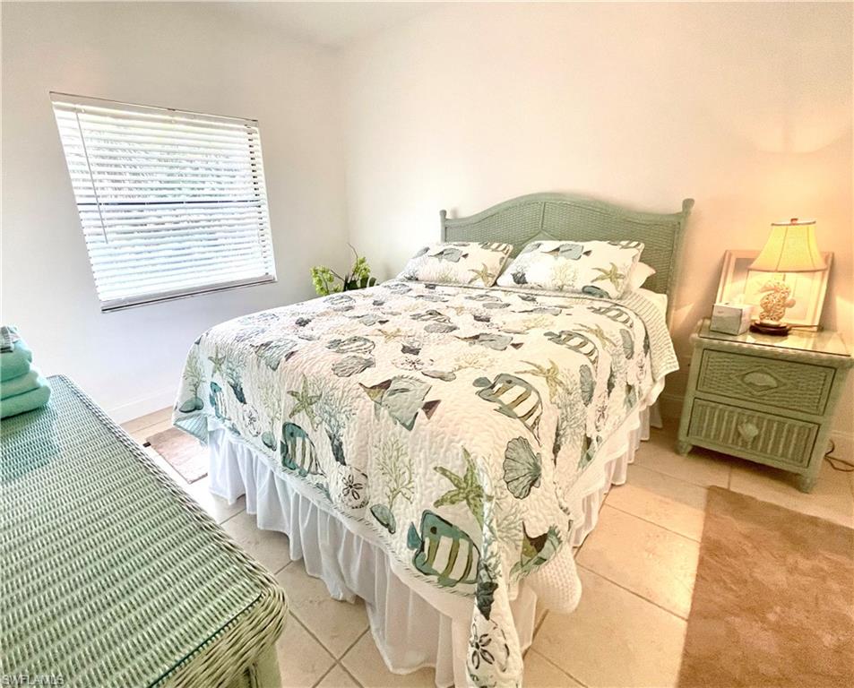 Undisclosed Address Naples, FL 34105 - Photo 1 of 15 a bedroom with a bed and a window
