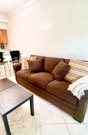 a living room with furniture and a couch