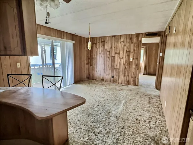 a kitchen with stainless steel appliances a sink stove and cabinets