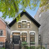 a front view of a house with glass windows