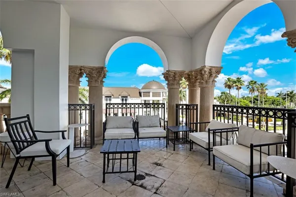 a view of a balcony with chairs