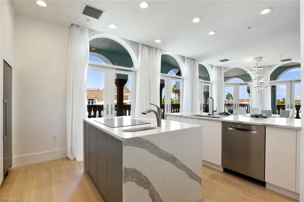a kitchen with lots of counter top space and sink