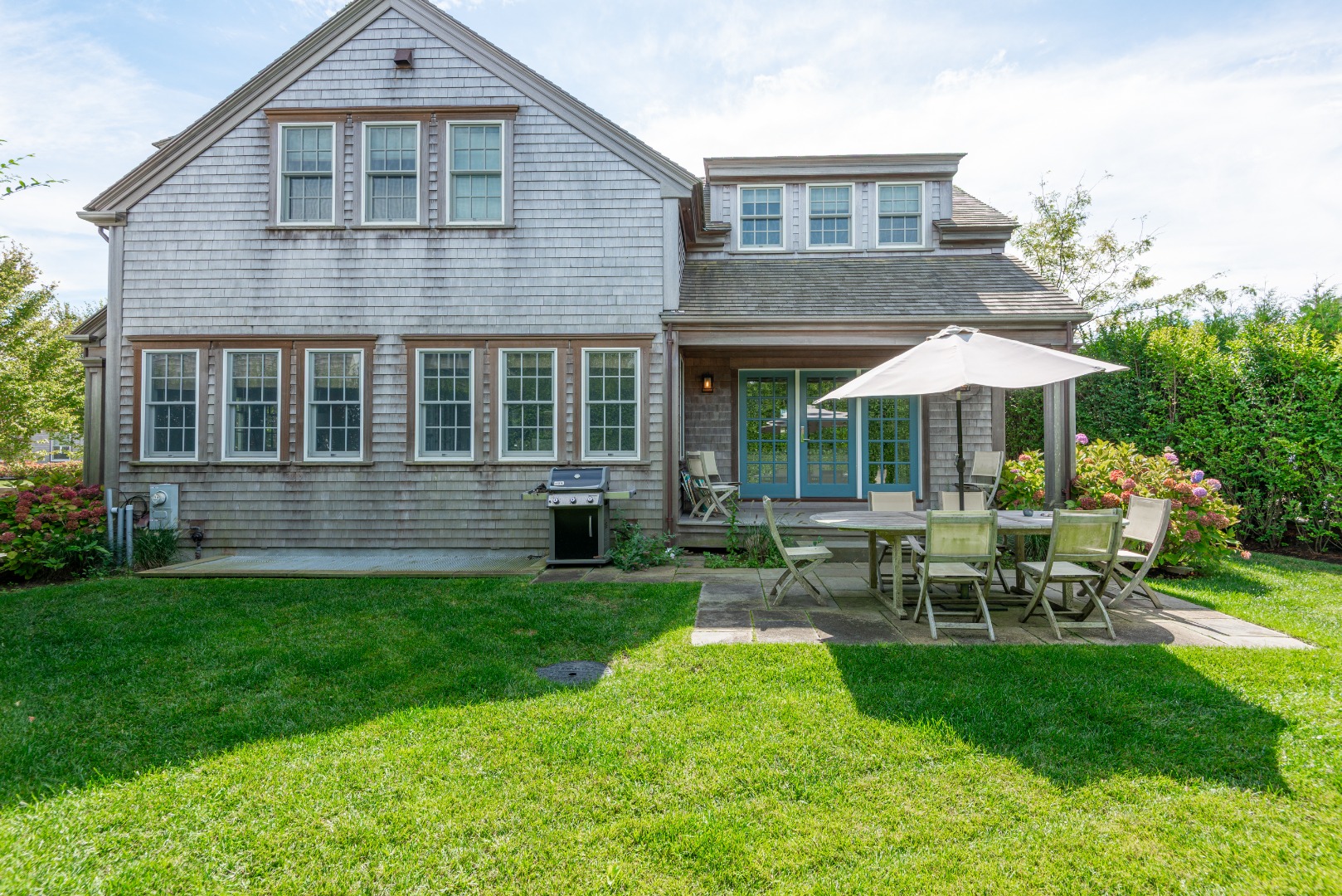 15 Gingy Lane Nantucket, MA 02554 - Photo 21 of 47 Cottage Side Elevation with private yard and patio