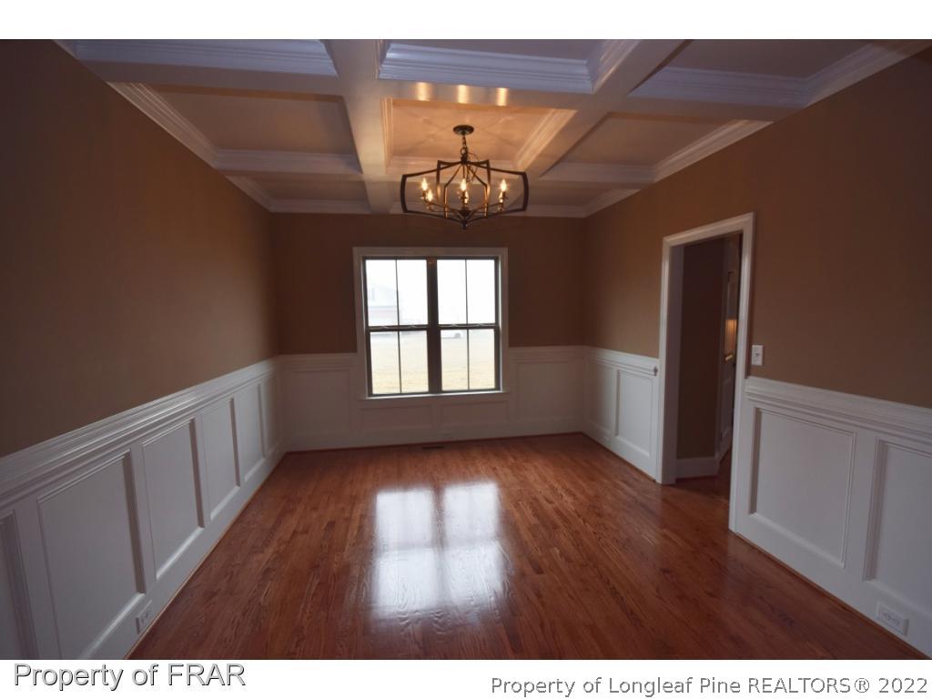 800 South River Road Stedman, NC 28391 - Photo 12 of 23 a view of an empty room with wooden floor and a window