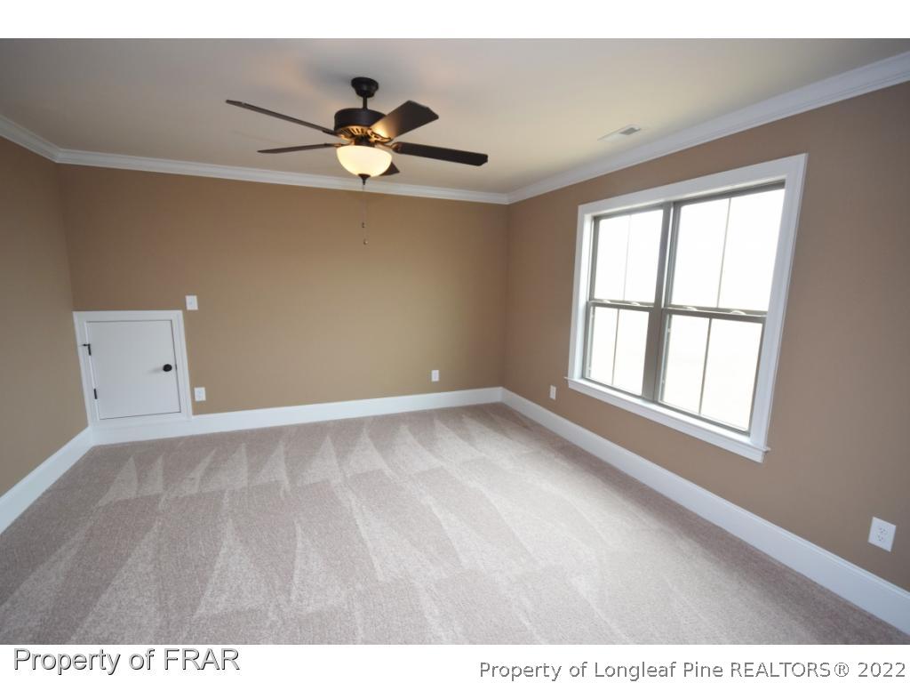 800 South River Road Stedman, NC 28391 - Photo 16 of 23 a view of an empty room with a window