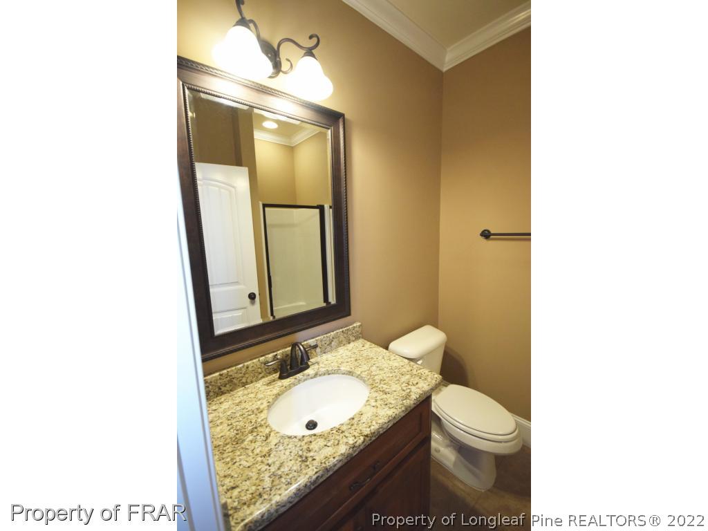 800 South River Road Stedman, NC 28391 - Photo 20 of 23 a bathroom with a toilet sink and mirror