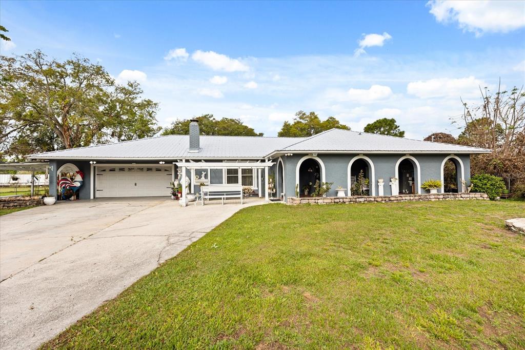 2270 Old Hickory Tree Road St. Cloud, FL 34772 - Photo 13 of 40 a view of house and outdoor space with swimming pool