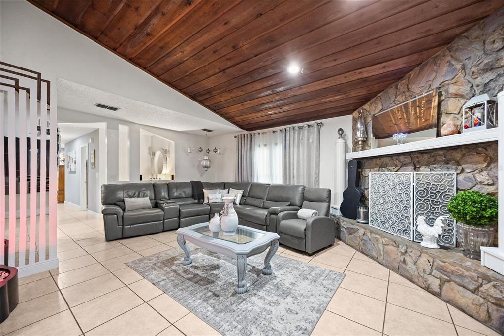 2270 Old Hickory Tree Road St. Cloud, FL 34772 - Photo 15 of 40 a living room with furniture and a fireplace